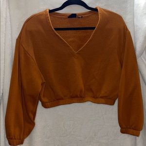 Out from under cropped sweater